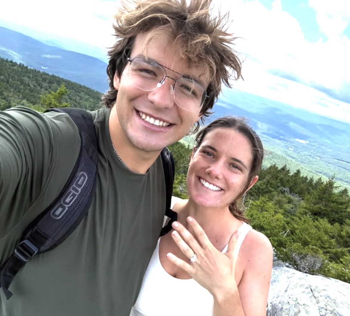 William and Dorrie on a mountain summit, ring on her hand